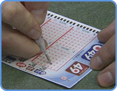Canada Lotto 6-49 player chooses his lucky numbers.